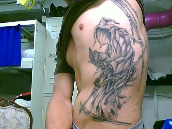 Awesome Black And Grey Grim Reaper Tattoo On Man Side Rib
