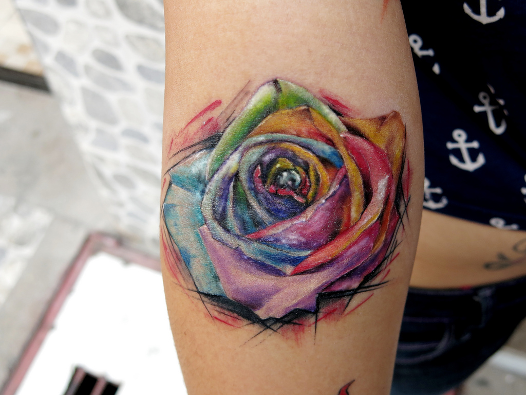Awesome Rainbow Rose Tattoo On Forearm