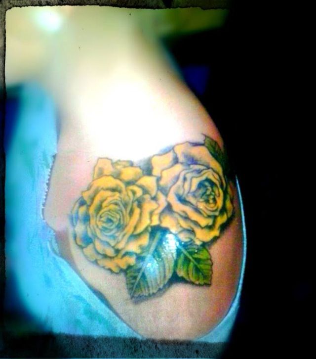 Awesome Two Yellow Roses Tattoo On Girl Left shoulder