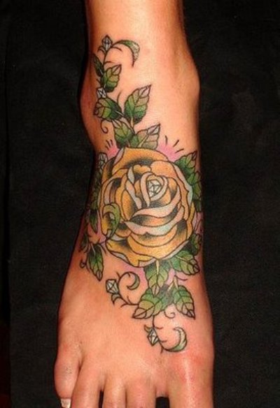 Awesome Yellow Rose With Leaves Tattoo On Foot