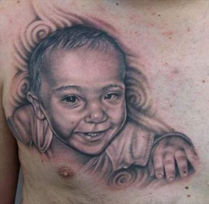 Black And Grey Baby Portrait Tattoo On Man Chest