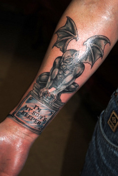 Black And Grey Gargoyle Statue Tattoo On Forearm