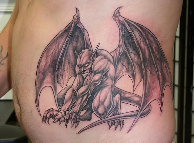 Black And Grey Gargoyle Tattoo On Man Side Rib