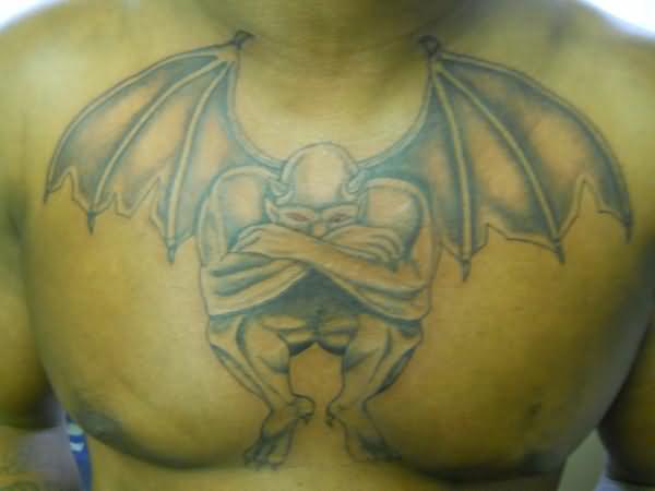 Black And Grey Gargoyle Tattoo On Man Chest