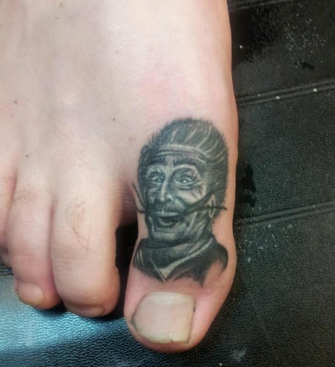 Black And Grey Man Portrait Tattoo On Toe By Daemion Goodwin