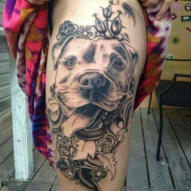 Black And Grey Pitbull Dog Head With Flowers Tattoo On Side Thigh