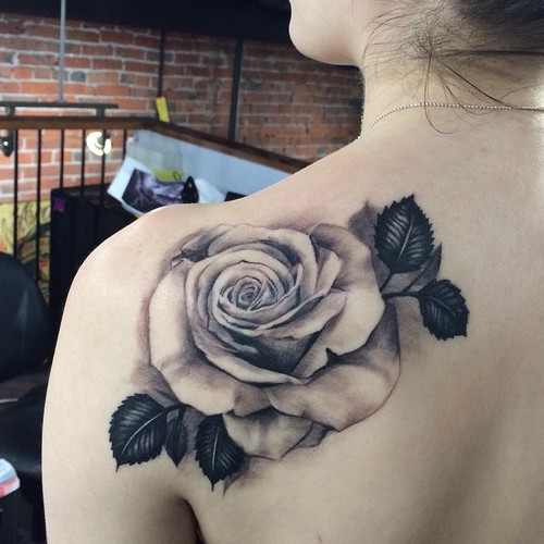 Black And White Rose Tattoo On Girl Left Back Shoulder