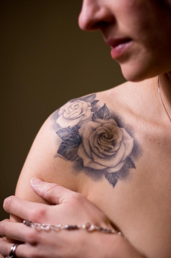 Black And White Two Roses Tattoo On Girl Right Front Shoulder