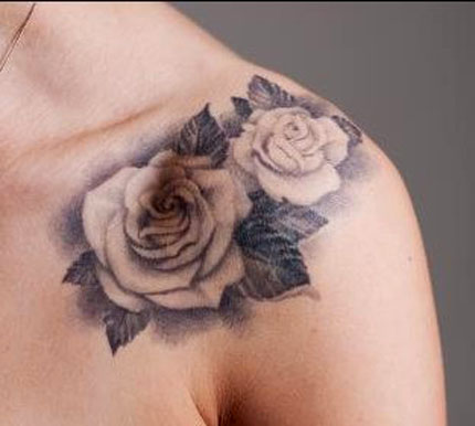 Black And White Two Roses Tattoo On Left Front Shoulder