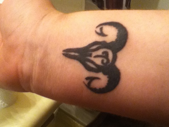 Black Aries Skull Tattoo On Wrist By Ashley Tia