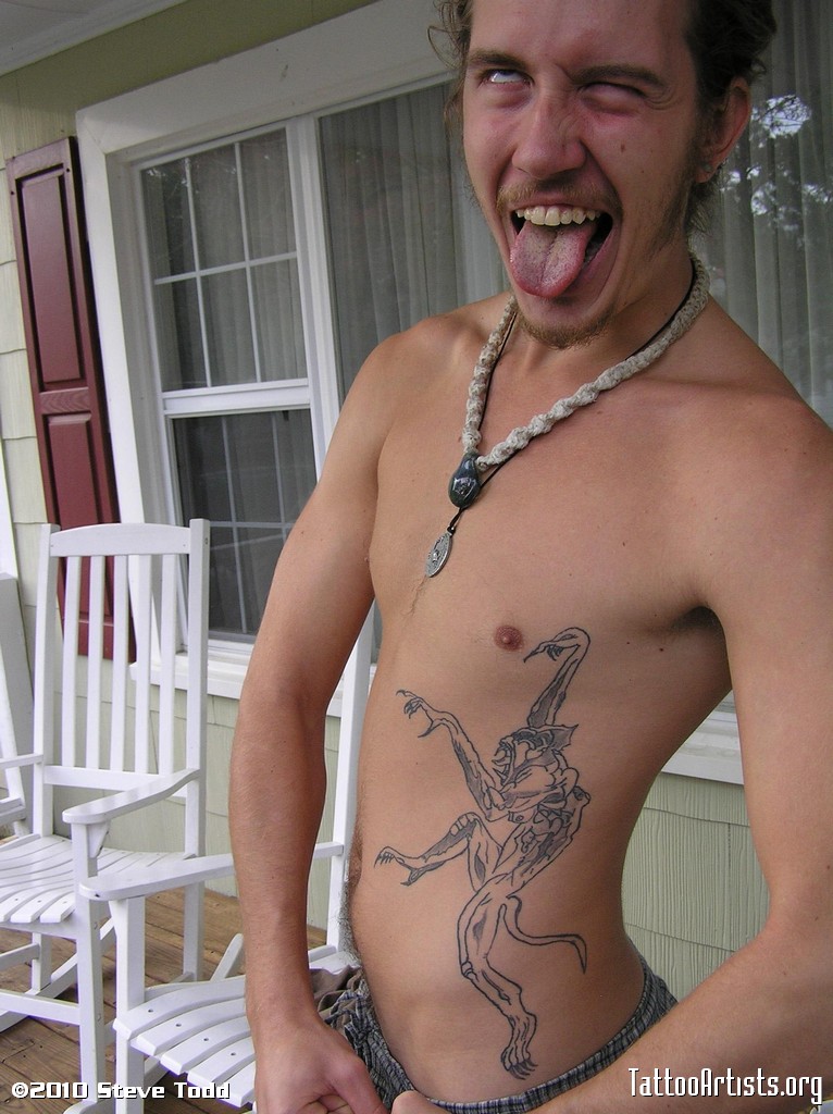 Black Gargoyle Tattoo On Man Side Rib