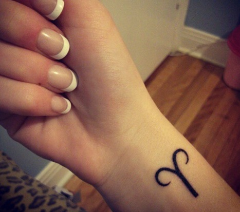 Black Ink Aries Wrist Tattoo For Girls