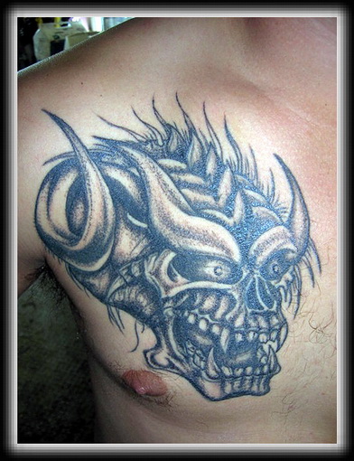 Black Ink Gargoyle Head Tattoo On Man Chest
