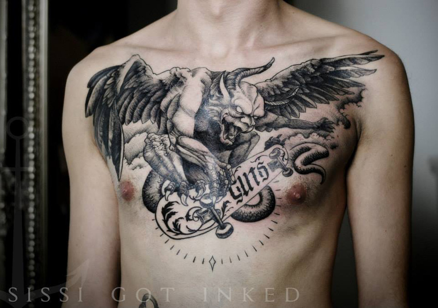 Black Ink Gargoyle With Banner Tattoo On Man Chest