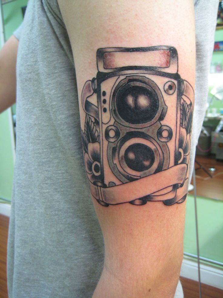 Black Ink Old Camera Tattoo On Left Half Sleeve