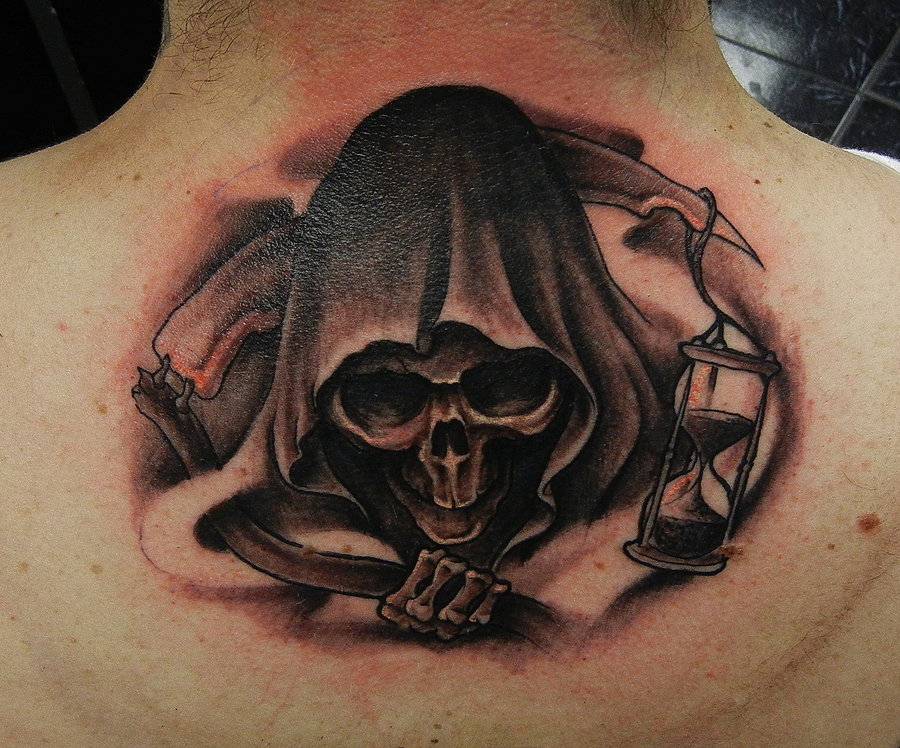 Black Ink Reaper Head Tattoo On Upper Back By Geri