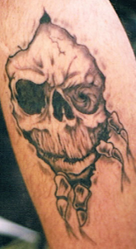 Black Ink Torn Skin Skull Tattoo Design For Forearm