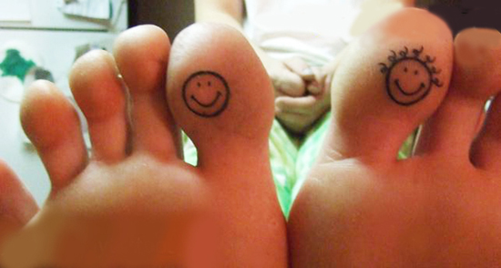 Black Outline Smiley Face Tattoo On Feet Toes