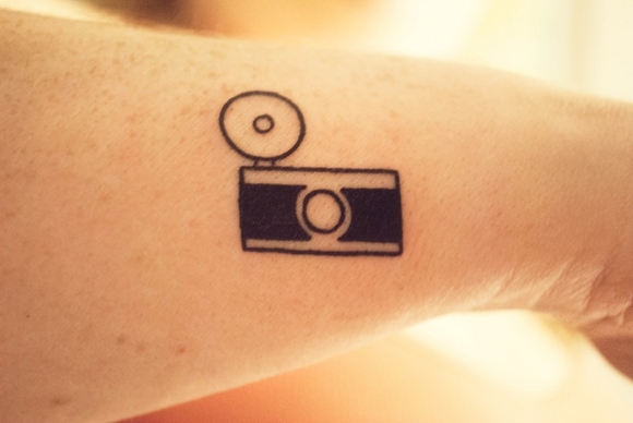 Black Simple Old Camera Tattoo Design For Forearm