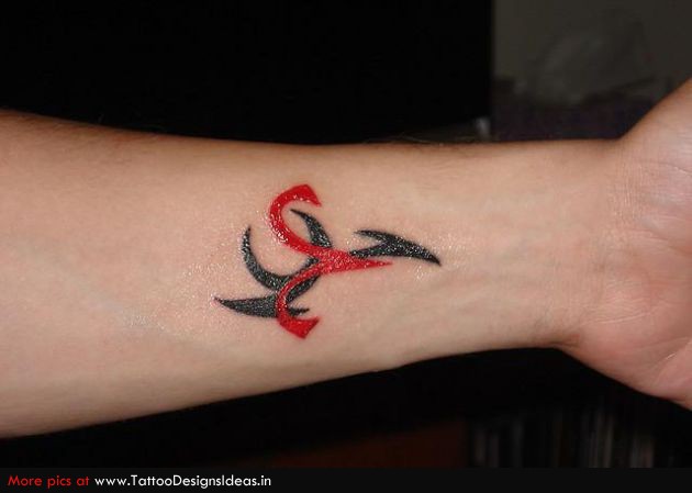 Black Tribal And Red Aries Zodiac Sign Tattoo On Wrist