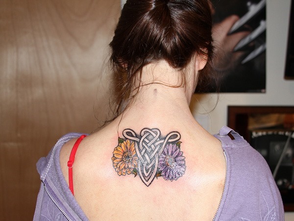 Celtic Aries Head With Flowers Tattoo On Girl Upper Back