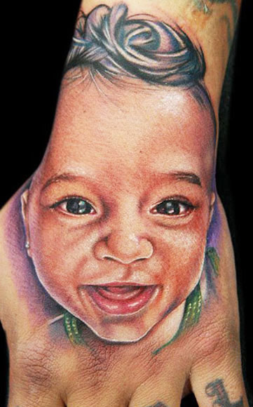 Colorful Baby Portrait Tattoo On Hand