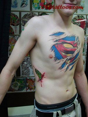 Colorful Torn Skin Superman Logo Tattoo On Man Chest