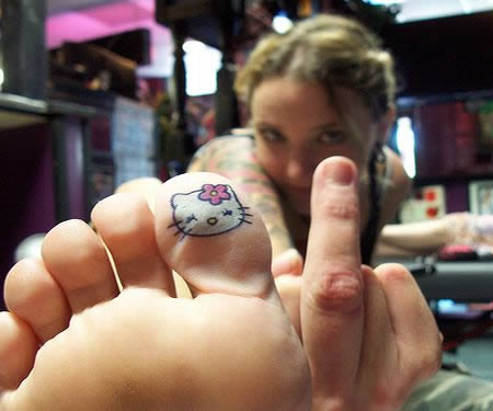 Hello Kitty Tattoo On Girl Under Toe