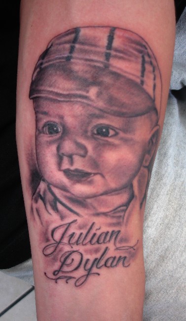 Julian Dylan - Black Ink Baby Portrait Tattoo Design For Arm