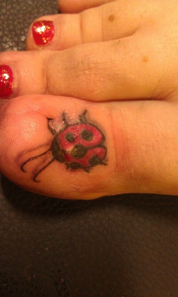 Ladybird Tattoo On Girl Toe