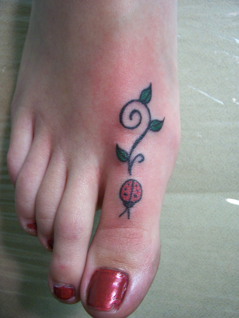Ladybird With Vine Tattoo On Girl Toe