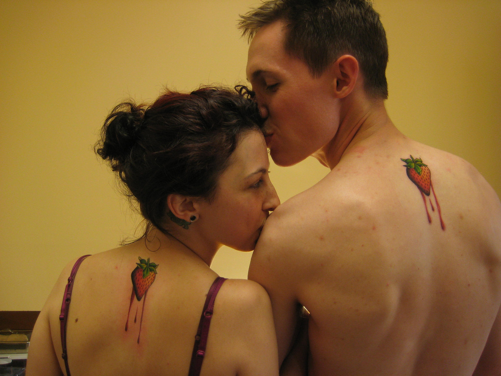 Melting Strawberry Tattoo On Couple Upper Back By Shannon Archuleta