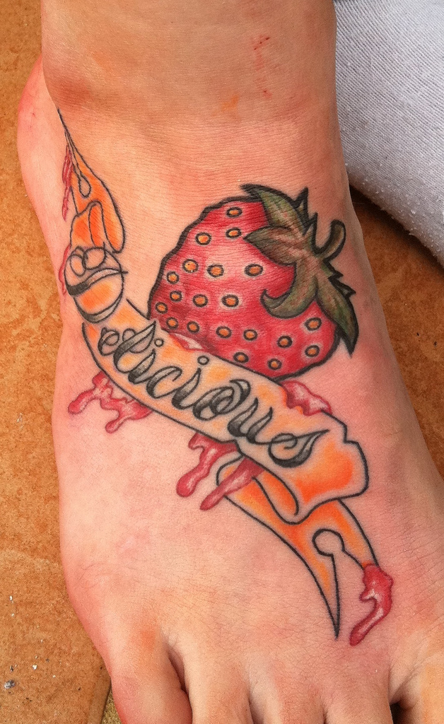 Melting Strawberry With Banner Tattoo On Foot