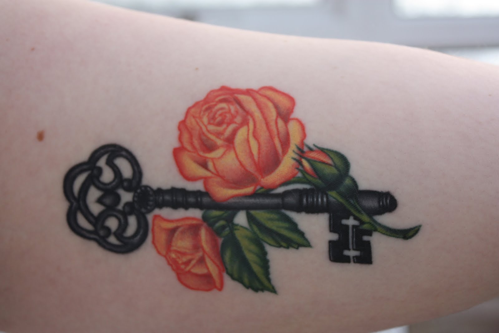 Orange Roses With Key Tattoo Design For Arm