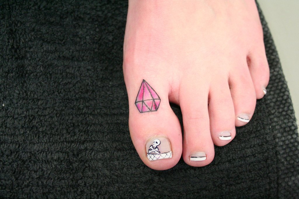 Pink Ink Diamond Tattoo On Girl Toe By 2Face