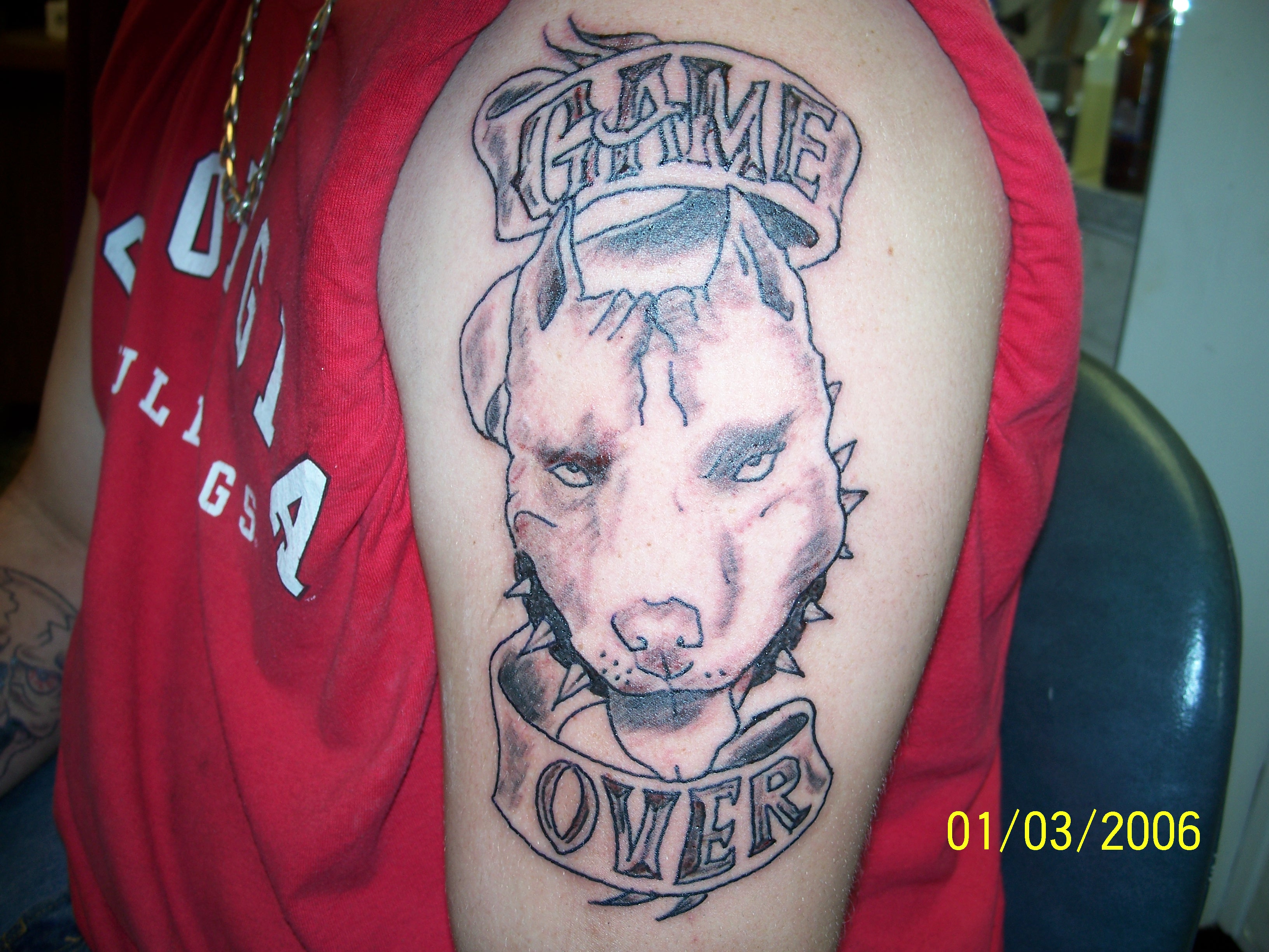Pit Bull Dog Head With Banner Tattoo On Man Left Half Sleeve