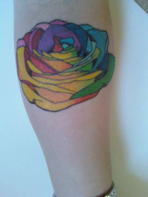 Rainbow Color Rose Tattoo On Forearm