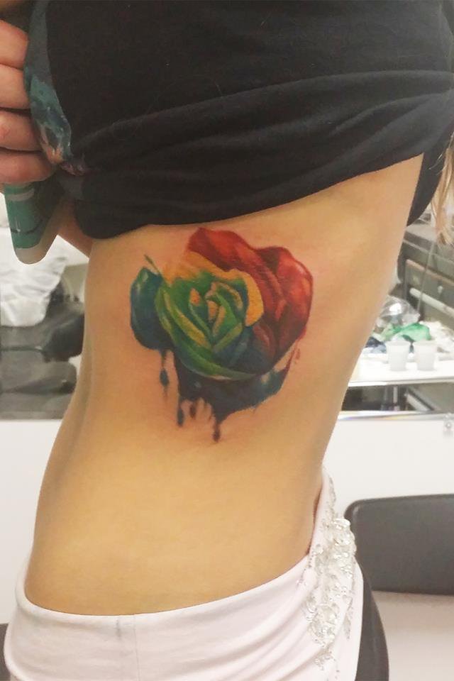 Rainbow Color Rose Tattoo On Girl Side Rib
