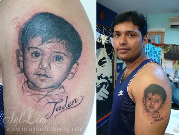 Realistic Baby Portrait Tattoo On Man Left Shoulder