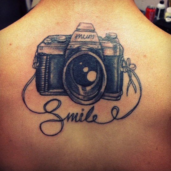 Smile - Black Ink Camera Tattoo Design For Upper Back