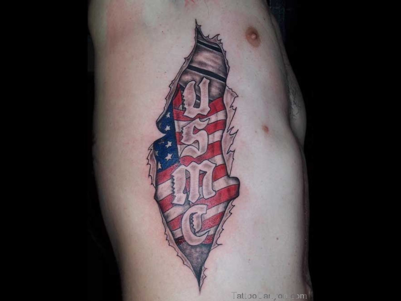 Torn Skin USA Flag Tattoo On Man Side Rib