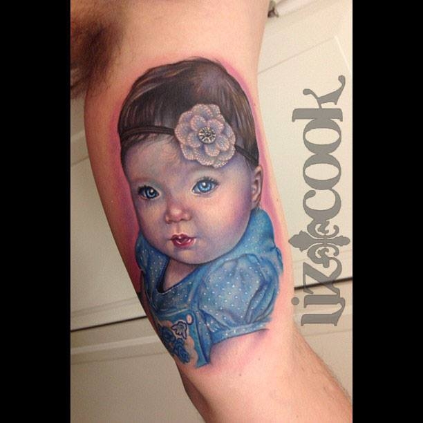 Unique Baby Portrait Tattoo On Bicep