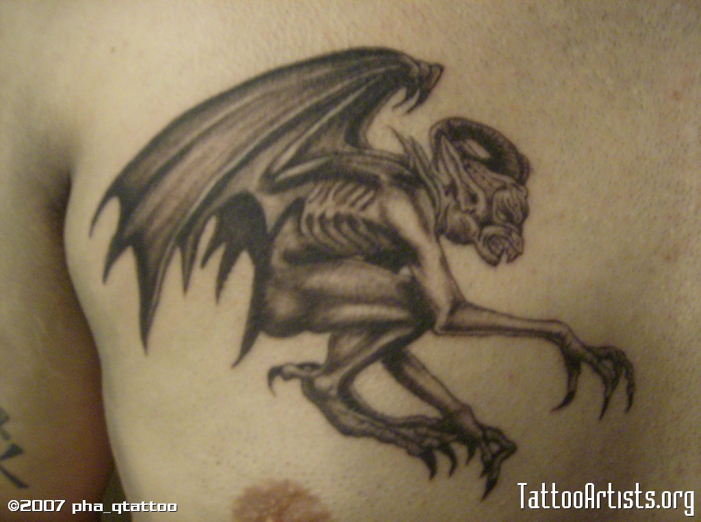 Unique Black And Grey Gargoyle Tattoo On Man Chest