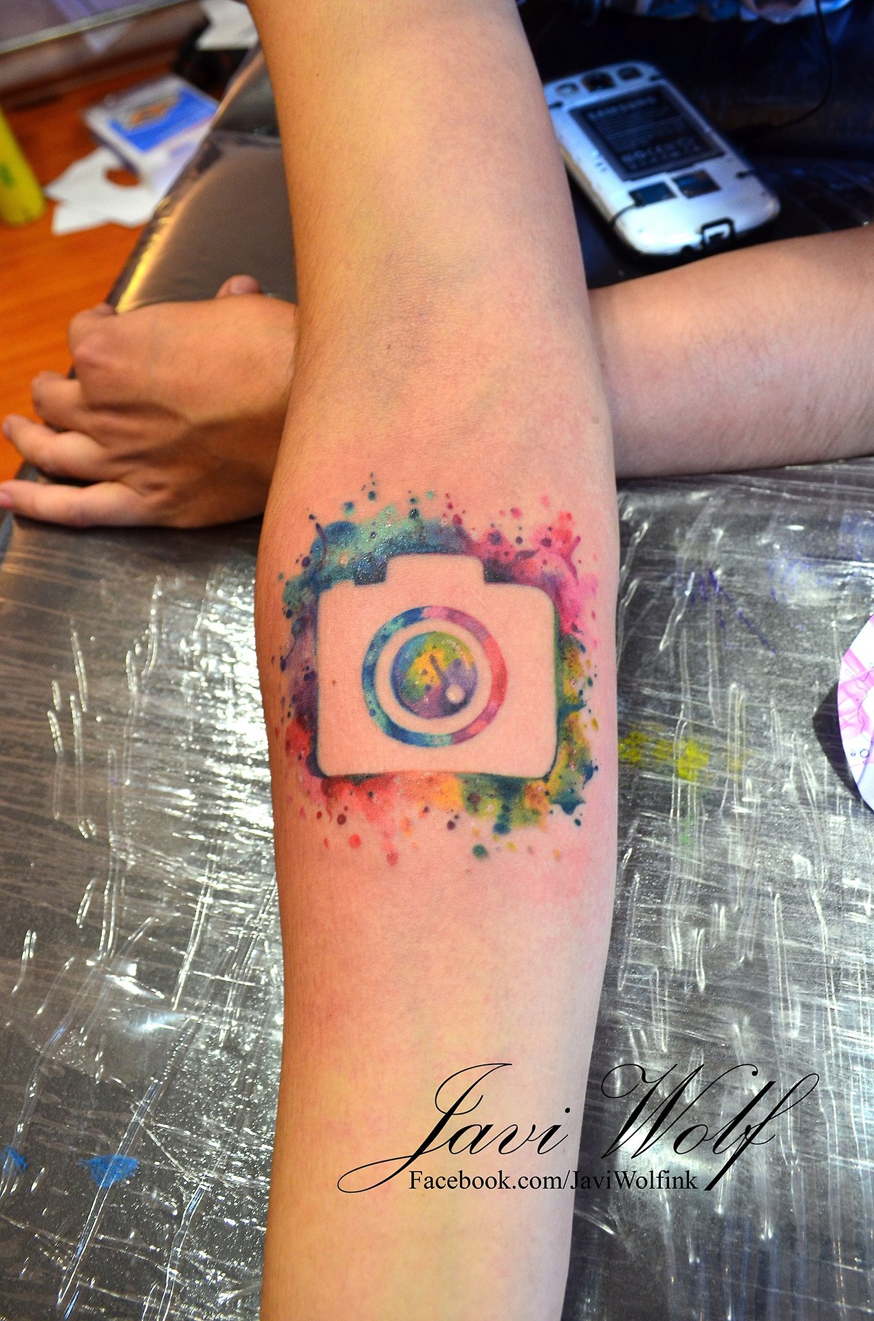 Unique Watercolor Camera Tattoo On Forearm By Javi Wolf