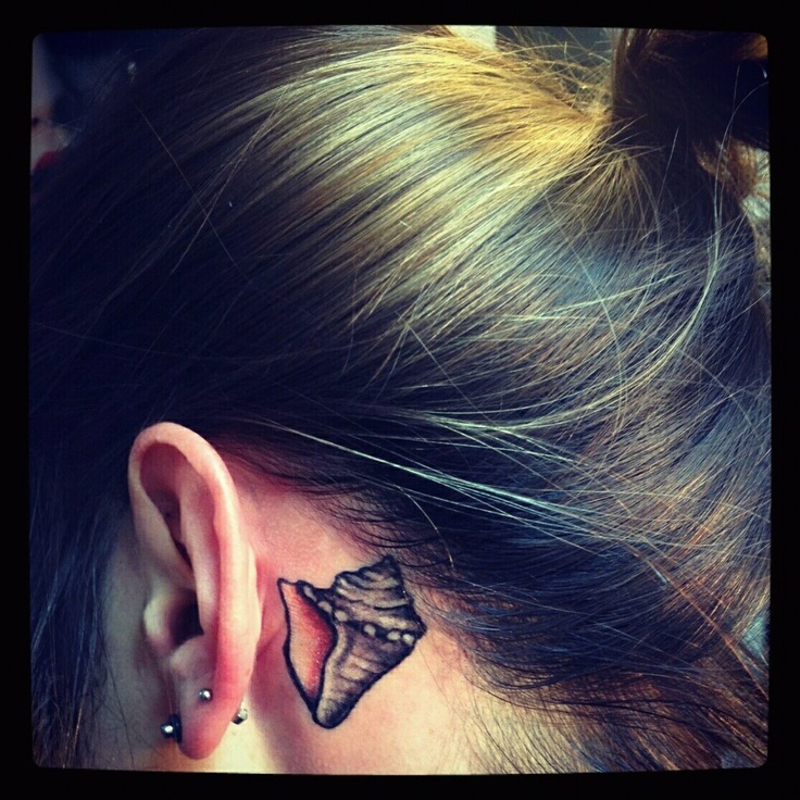 Amazing Black Conch Shell Tattoo On Girl Behind The Ear