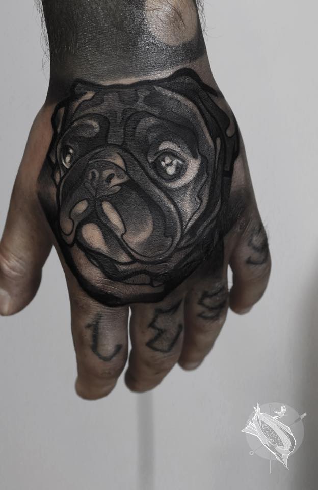 Amazing Black Ink Pug Dog Head Tattoo On Hand