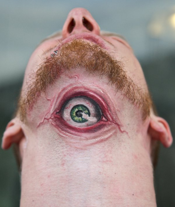 Amazing Eyeball Tattoo On Man Under Chin