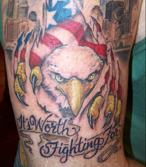 Amazing Ripped Skin USA Eagle With Banner Tattoo On Bicep