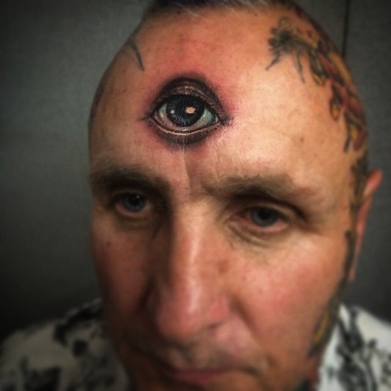 Awesome Black And Grey Eyeball Tattoo On Man Forehead