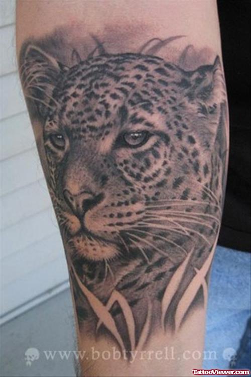 Awful leopard tattoo on arm by Bob Tyrrell